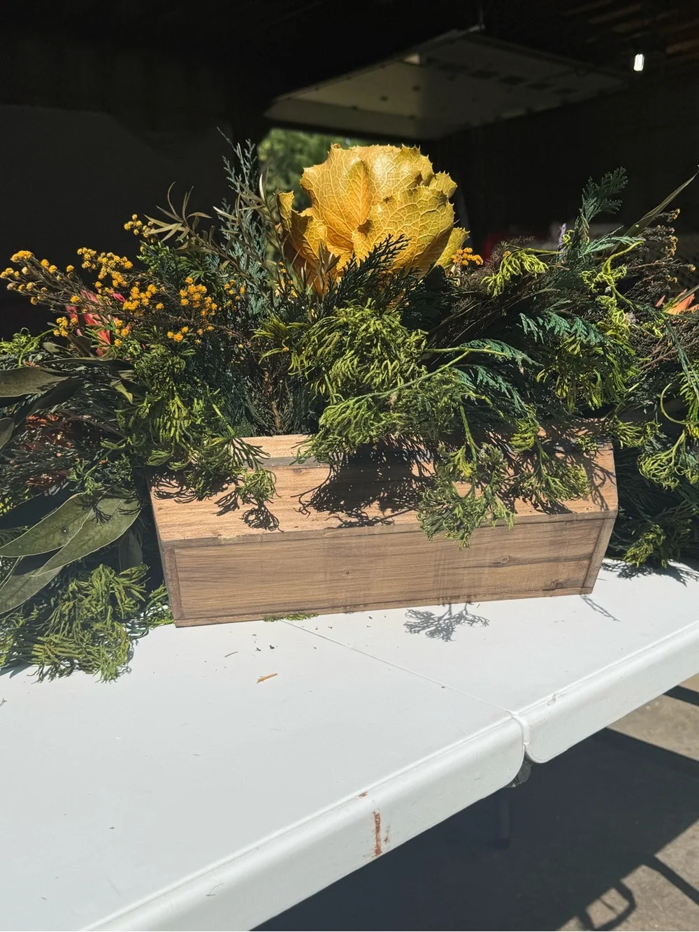 Autumn table center piece or decoration floral leaves full in planter box